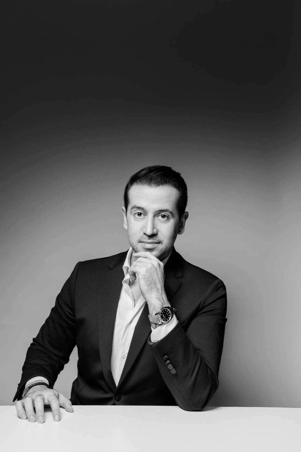 Editorial seated portrait — black & white