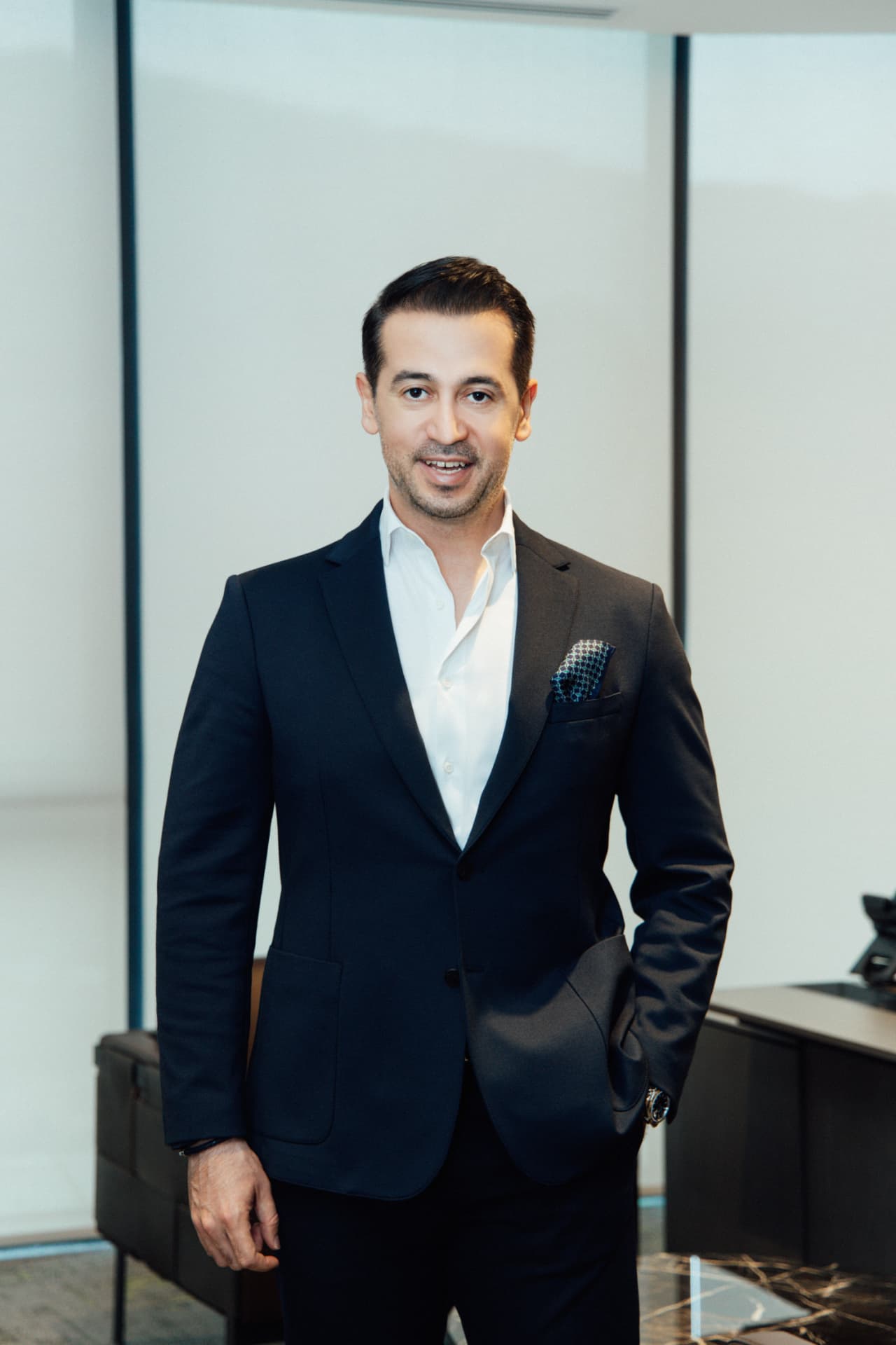 Murat Durak standing portrait in executive office